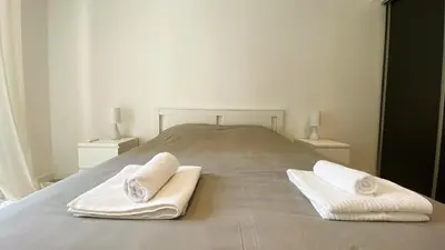 Un ou plusieurs lits dans un hébergement de l'établissement Vilmorin Appartement 1 Chambre proche de gare, plage, centre
