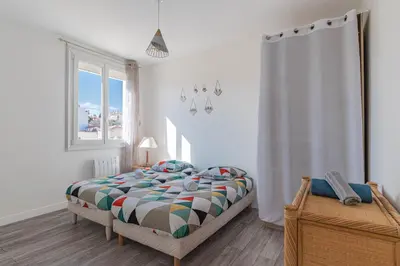 Un ou plusieurs lits dans un hébergement de l'établissement Appt lumineux et spacieux au cœur de Cannes