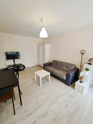 Coin salon dans l'établissement BEL AIR - Studio, Proche centre, WIFI, Climatisation