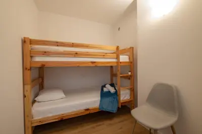 Un ou plusieurs lits superposés dans un hébergement de l'établissement SERRENDY RARE ! Superbe appartement avec vue sur la mer