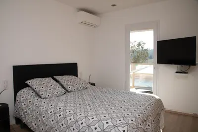Un ou plusieurs lits dans un hébergement de l'établissement Maison avec piscine à Biot Antibes