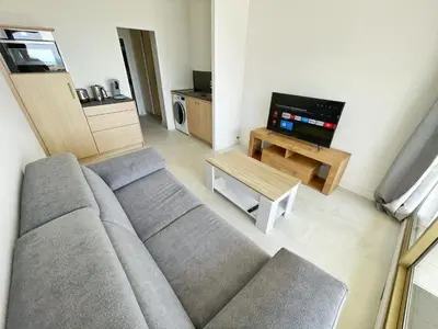 Télévision ou salle de divertissement dans l'établissement #902 MARINA RIVIERA BAY - Marina Baie des Anges