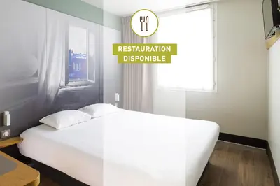 Un ou plusieurs lits dans un hébergement de l'établissement B&B HOTEL Antibes Sophia Le Relais