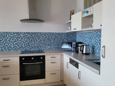 Cuisine ou kitchenette dans l'établissement Center Bay T4