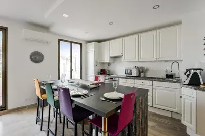 Cuisine ou kitchenette dans l'établissement Appartement Mésangia - Welkeys