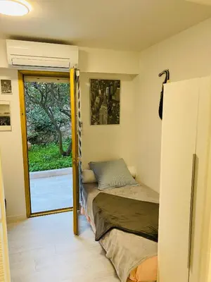 Un ou plusieurs lits dans un hébergement de l'établissement 3 pièces terrasse, jardin