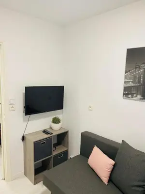 Télévision ou salle de divertissement dans l'établissement 3 pièces terrasse, jardin