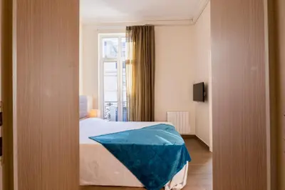 Un ou plusieurs lits dans un hébergement de l'établissement 3 pièces rue dAntibes à deux pas du Palais des festivals