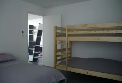 Un ou plusieurs lits dans un hébergement de l'établissement Appart dans maison 2 km de la plage