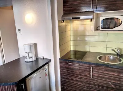 Cuisine ou kitchenette dans l'établissement Résidence Graziella Studio 110