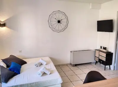 Télévision ou salle de divertissement dans l'établissement Résidence Graziella Studio 307