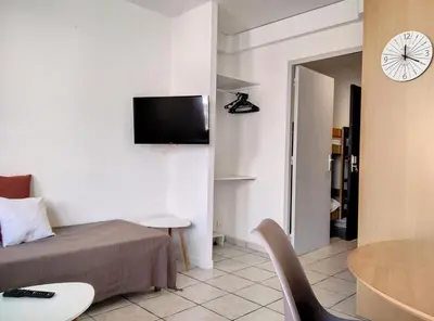 Télévision ou salle de divertissement dans l'établissement Résidence Graziella Studio 408
