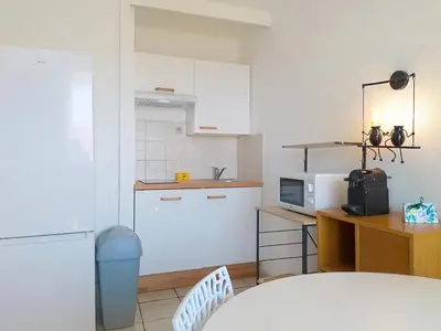 Cuisine ou kitchenette dans l'établissement Résidence Graziella Studio 423