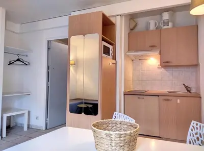 Cuisine ou kitchenette dans l'établissement Résidence Graziella Studio 203