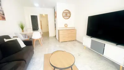 Télévision ou salle de divertissement dans l'établissement Le Magali