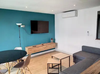 Télévision ou salle de divertissement dans l'établissement Résidence le Serra