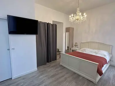 Un ou plusieurs lits dans un hébergement de l'établissement Cannes Studio situé dans la résidence Gallia Historique