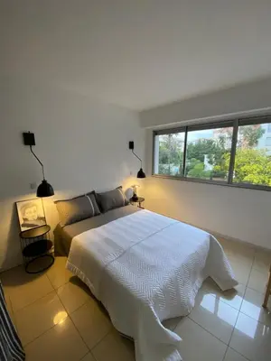 Un ou plusieurs lits dans un hébergement de l'établissement Grand appartement de style avec parking - Cannes