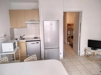 Cuisine ou kitchenette dans l'établissement Résidence Graziella Studio 506