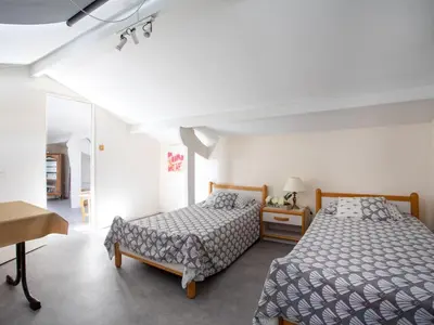 Un ou plusieurs lits dans un hébergement de l'établissement Apartment le flora by Interhome