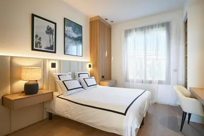 Un ou plusieurs lits dans un hébergement de l'établissement Les DUNES 3 BEDS CROISETTE BEACHES Sea VIEW