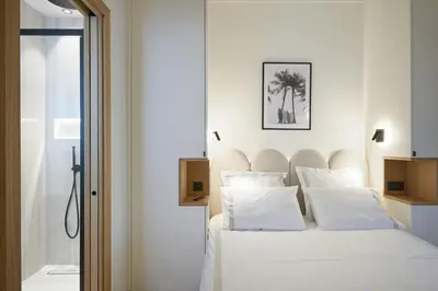 Un ou plusieurs lits dans un hébergement de l'établissement Les DUNES 3 BEDS CROISETTE BEACHES Sea VIEW