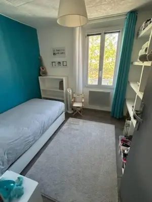 Un ou plusieurs lits dans un hébergement de l'établissement Appartement familial entre Cannes et Juan-les-Pins
